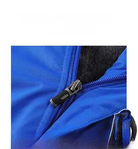 Close-up of smooth zipper on a blue fleece-lined outdoor windproof jacket