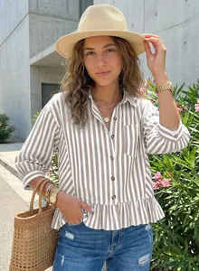 Close-up detail of women's striped commute shirt with ruffled hem and button-up front