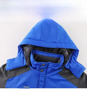 Detailed view of a blue outdoor jacket featuring a fleece-lined hood and high collar design