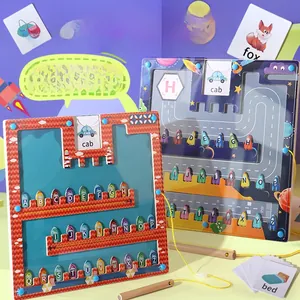 Close-up of magnetic alphabet maze boards with cards for letter recognition.
