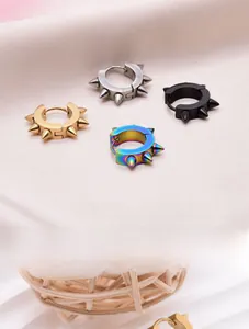 Four punk style stainless steel spiked hoop earrings in gold, black, silver, and rainbow
