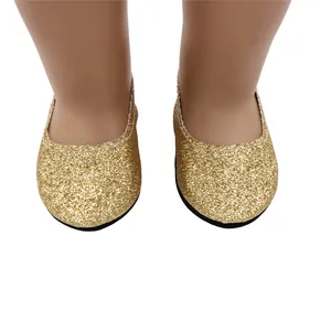 Close-up of sparkling gold glitter flat shoes for 18-inch dolls