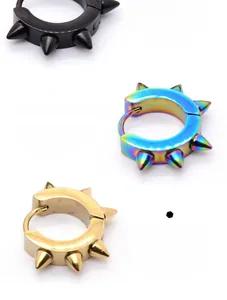 Close-up of punk-style stainless steel spike hoop earrings in black, gold, and rainbow.
