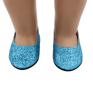 Close-up view of blue glitter doll shoes for 18-inch dolls with sparkling finish.