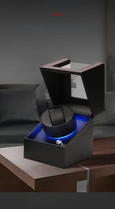Close-up of single automatic watch winder with carbon fiber texture and blue LED light