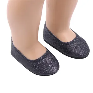 Close-up of black glittery flat shoes perfect for 18-inch American Girl style dolls.