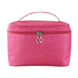 Spacious portable pink cosmetic bag featuring a top handle and secure double zip closure