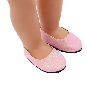 Close-up detail of pink glitter flat shoes for 18-inch dolls with white stitching.