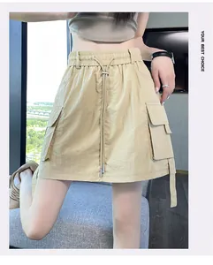 Detail view of khaki utility cargo skort featuring high waist and drawstring closure