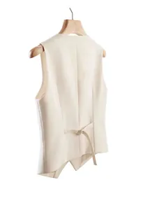 Rear view of cream women's suit vest featuring an adjustable buckle strap detail