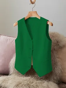 Close-up detail of a vibrant green tailored suit vest for women's wear