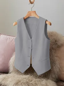 Detail view of this gray women's suit vest featuring front buttons and smooth fabric