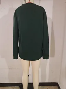 Back view of dark green waffle knit long sleeve shirt for men with ribbed cuffs