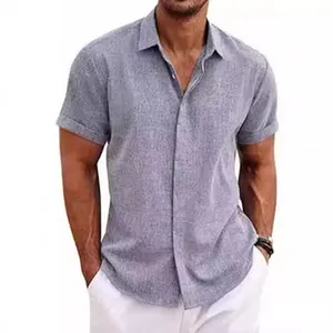 Detail of men's grey linen-textured short sleeve shirt with cuffed sleeves.