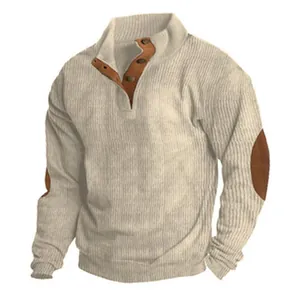 Close-up of men's ribbed knit sweater with elbow patches and button collar