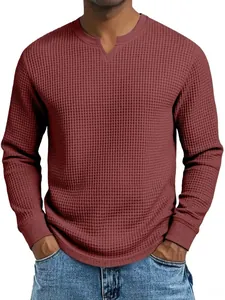 Close-up of maroon waffle-knit men's long-sleeve shirt with V-neck detail