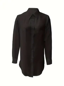 Detailed view of women's black long sleeve button-down blouse with irregular hem
