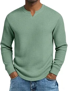 Close-up detail of a sage green waffle knit long sleeve shirt featuring a notch V-neck