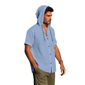 Detail of light blue men's hooded linen shirt with short sleeves and button closure.