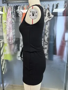 Detailed side view of a black ribbed sleeveless knit dress on a mannequin.