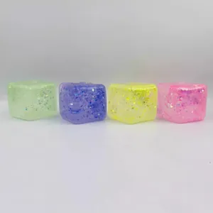 Set of four colorful glitter ice cube squishy toys for stress relief and sensory play