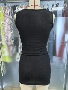Detailed back view of a black ribbed sleeveless knitted dress displayed on a mannequin