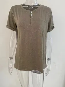 Detail view of women's loose Henley t-shirt with front buttons and chest pocket
