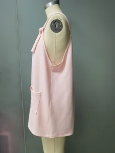 Detailed side profile of light pink sleeveless top with pocket shown on mannequin