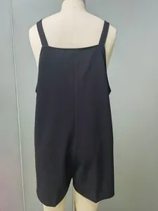 Back view of a minimalist black sleeveless strap romper jumpsuit on a tailor mannequin