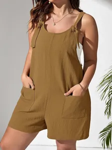 Close-up of women's brown textured fabric romper with tie-up straps and pockets