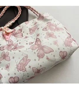 Close-up of floral butterfly print tote bag made from soft, high-quality fabric.