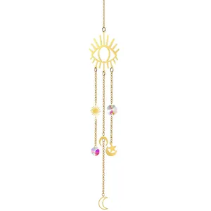 Detailed view of gold celestial suncatcher with iridescent crystal prisms and charms