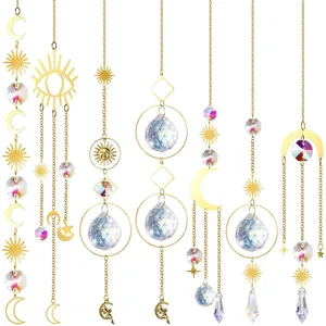 Variety of celestial suncatchers with iridescent crystal prisms and golden metal accents.