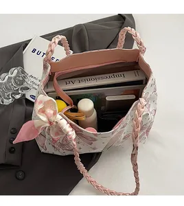 Detailed interior view of a large butterfly print tote bag showing spacious capacity for books