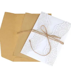 Elegant laser cut white lace wedding invitation set with kraft envelope and twine
