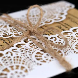 Elegant laser cut lace wedding invitation set with kraft paper card and jute twine bow