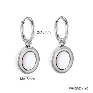 Detailed view of minimalist stainless steel hoop earrings with white shell inlay
