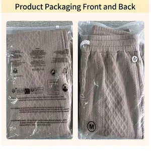 Detailed view of jacquard sports trousers packaging front and back in transparent zip bag.