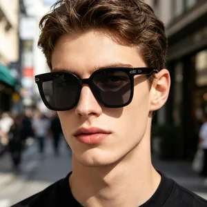 Close-up detail of stylish men's black square polarized sunglasses for outdoor driving