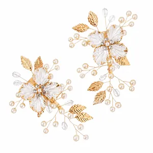 Elegant gold bridal hair clips with pearls and crystals for special wedding hairstyles