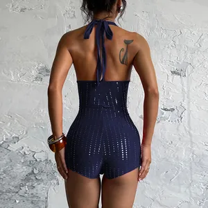 Vue arrière d'une barboteuse sexy bleu marine à licou avec des sequins et strass