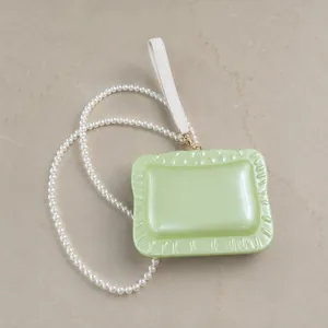 Elegant pale green acrylic evening clutch with pearl chain for wedding and party