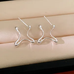 Minimalist silver geometric stud earrings with fluid lines for a modern stylish look.