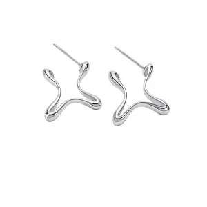 Modern minimalist silver stud earrings with fluid geometric lines and high-polish finish
