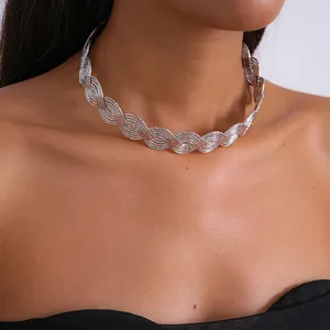 Detail view of silver wavy braided choker necklace on neck for elegant style