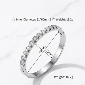Close-up of stainless steel bangle with round-cut crystals and inner diameter measurements
