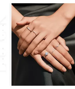 Elegant detail of stackable S925 sterling silver moissanite rings on model's hands