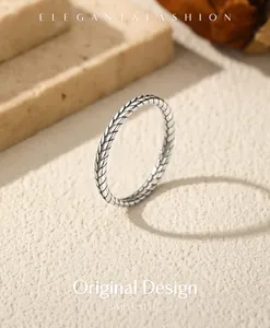 Macro detail of S925 sterling silver vintage wheat ear ring with oxidized finish