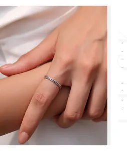 Close-up detail of a S925 sterling silver vintage wheat pattern ring worn on finger
