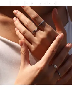 A close-up shot showing vintage S925 sterling silver wheat spike rings worn on hands